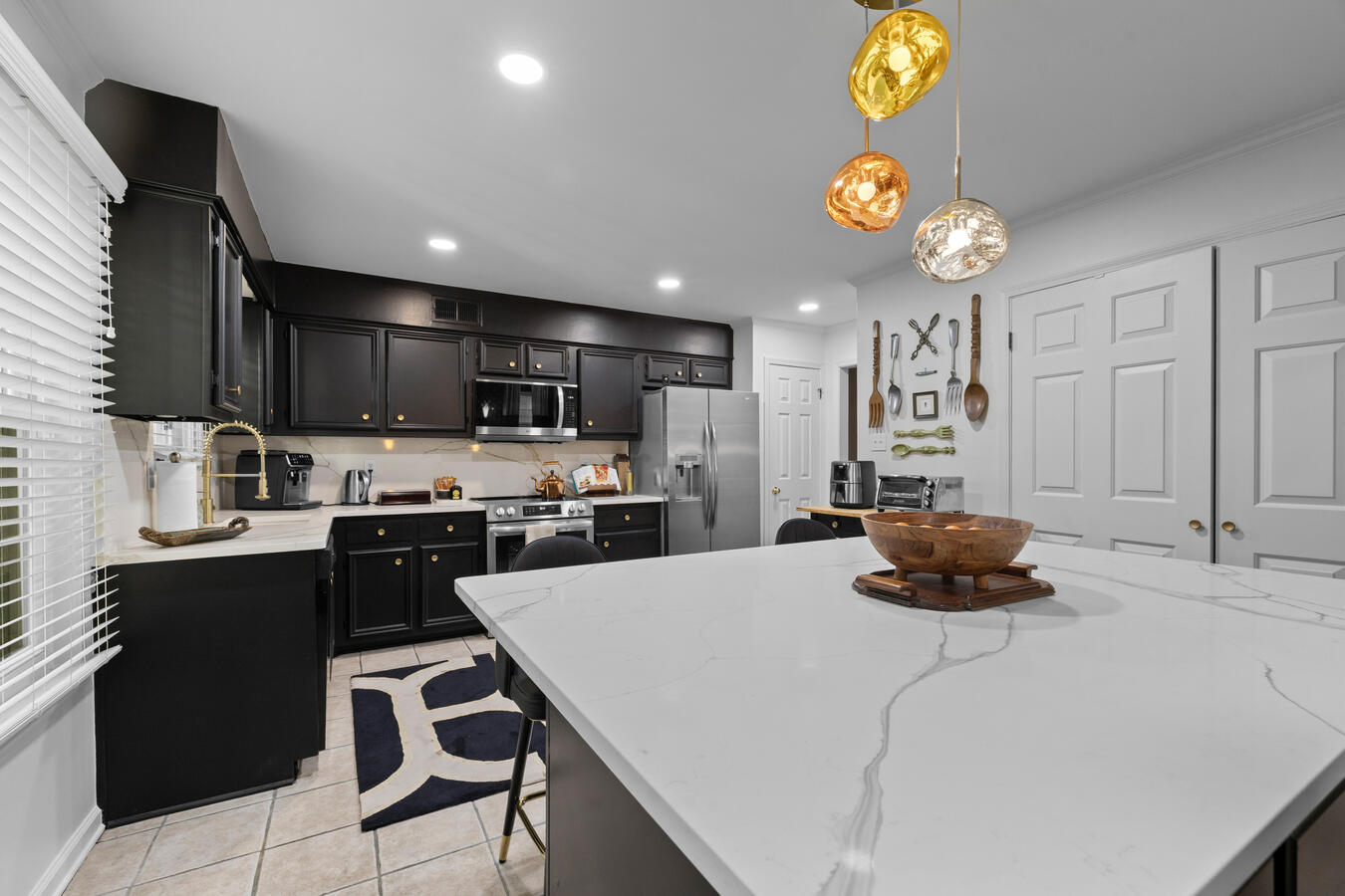 Golden light fixtures accent the space.